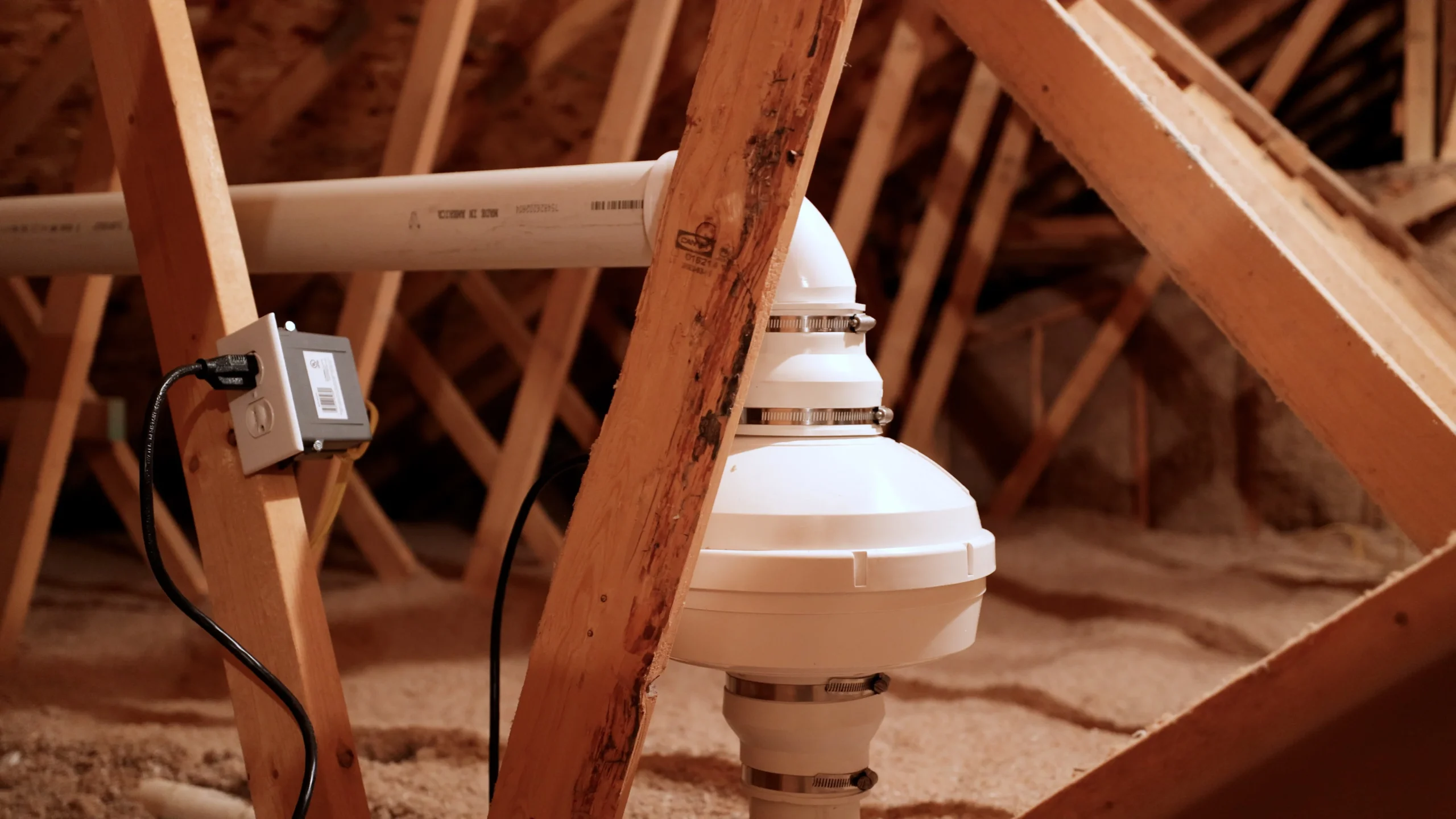 Radon fan and pipe installed in an attic